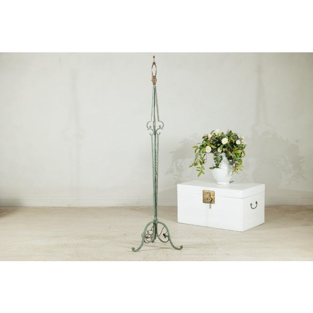 "About the Item This vintage wrought iron floor lamp features an elegant, elongated form accentuated by hand-forged...