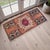This charming hand-knotted small rug showcases a vibrant yet sun-faded terracotta palette that brings immediate warmth to...