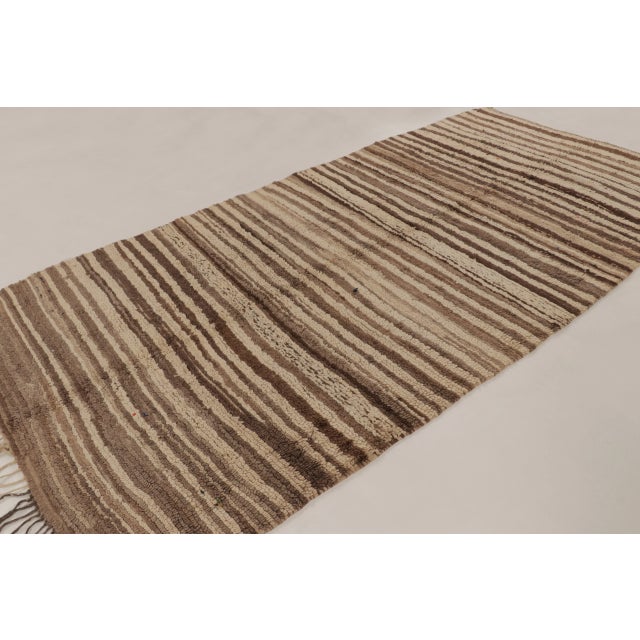 Handwoven in wool, this vintage 6x11 Moroccan rug is a sophisticated addition to Rug & Kilim’s collection of textural...
