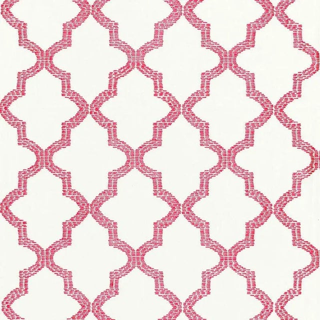 Mod meets Moroccan in this geometric pattern. A fretwork motif embroidered in thick rayon yarn adds dimension and sheen....