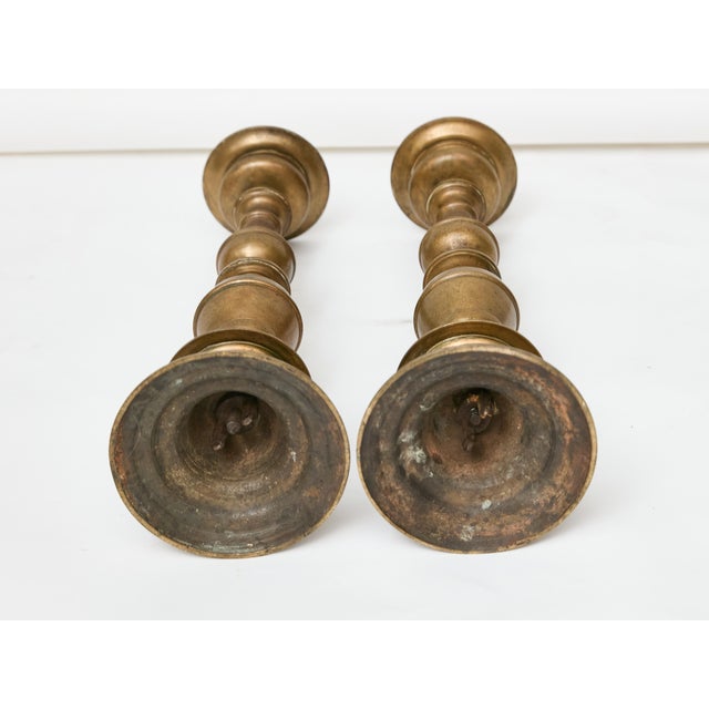 A tall and commanding pair of Italian pricket sticks in solid bronze, 18th century. At over 30 inches high, these were...