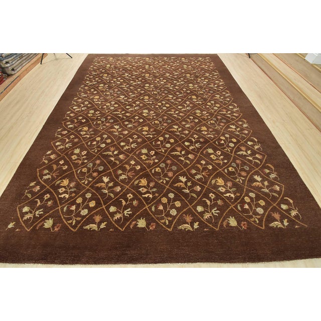 A traditional Aubusson rug hand-knotted with an all-wool pile on a cotton foundation. This oriental rug features an all-...