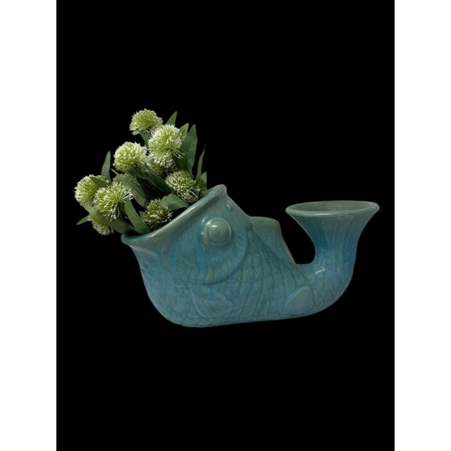 A large-scale vintage ceramic fish planter rendered in a luminous turquoise and sea-glass glaze, notable for its...