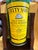Add an authentic splash of mid-century bar car culture to your space with this vintage 1-gallon Cutty Sark Blended Scots...