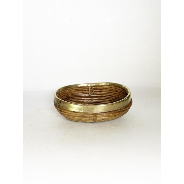 Rush and brass basket in the spirit of the French Riviera, blending natural elegance with vintage refinement. Made from...