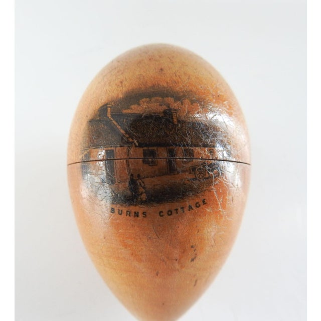 19th century wood Mauchline Ware egg shaped thimble holder from Scotland. Image of Robert Burns Cottage. Overall patina,...
