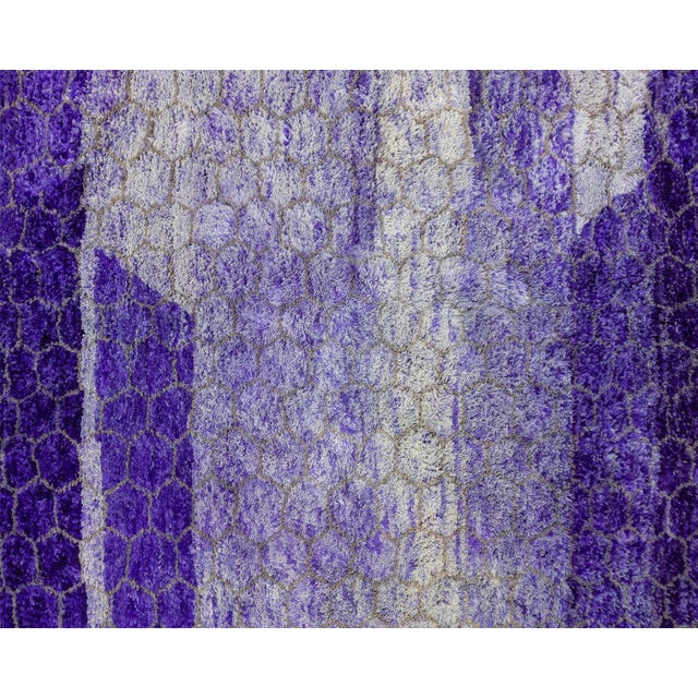 Exquisite hand-knotted rug with a honeycomb-inspired pattern in a rich spectrum of Royal Purple and Lush Lavender,...