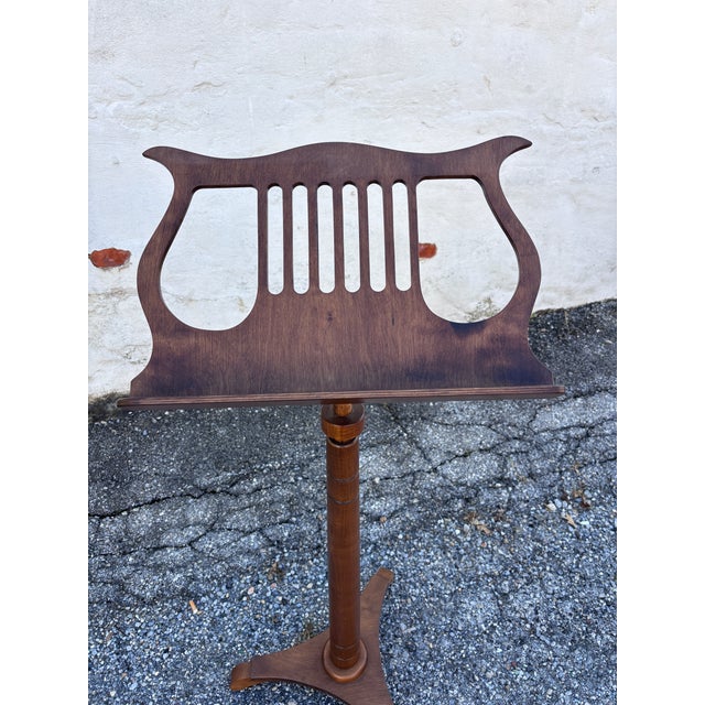 Vintage Wooden Adjustable Lyre Music Stand with Tripod Base. This music stand features warm wood finish, turned details to...