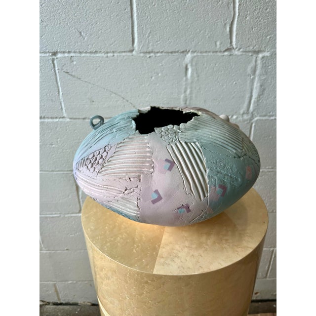A substantial hand-built studio pottery vessel by Gail Markiewicz, distinguished by its organic form and richly textured...