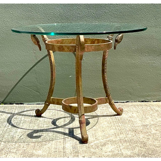 This stunning vintage drinks table is a quintessential example of Hollywood Regency glamour, blending classical motifs...