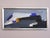 BLUE ECHOES Oil on board Size: 13.6 x 28.7 inches (including frame) A striking mid-century abstract composition that...