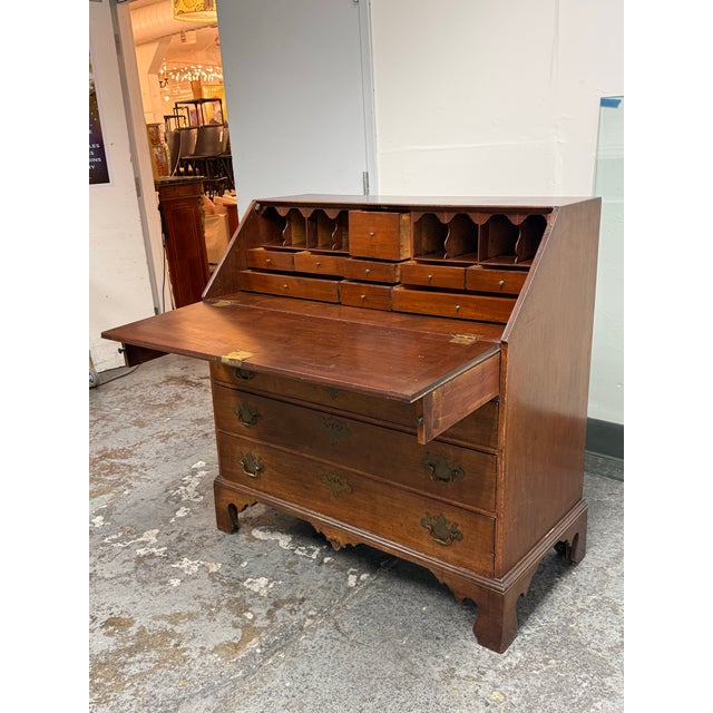 Design Plus Gallery presents an Antique Chippendale Style Mahogany Drop Front Secretary Desk. This traditional wooden...