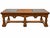 A vintage Mediterranean Revival coffee table featuring a warm brown wood finish, geometric parquet-pattern center panel,...