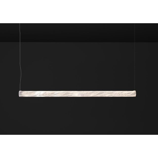 Ade l 1500 pendant lamp by alabastro italiano dimensions: d 8 x w 150 x h 8 cm. Materials: white alabaster and metal....