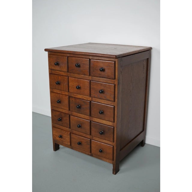 This cabinet was designed and made from oak around the 1930s in the Netherlands. It was part of a wall piece used in a...