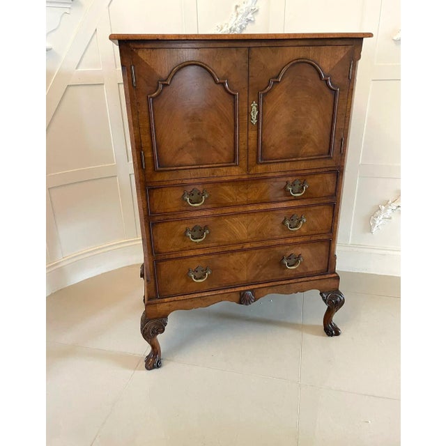 Antique quality burr walnut chest on stand having a quality crossbanded burr walnut top with a moulded edge above a pair...