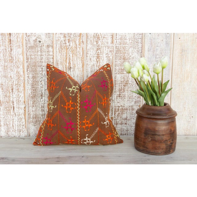 This colorful and luxurious Bagh Phulkari pillow features beautiful hand-done silk embroidery on top of a cotton fabric....