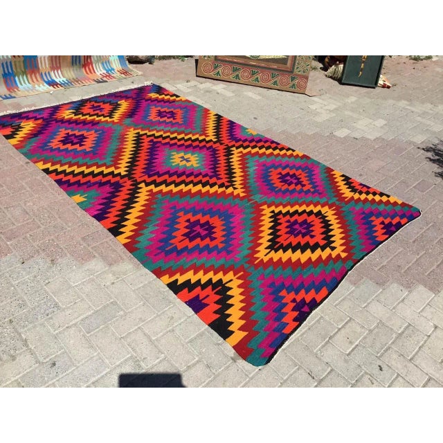 This beautiful, vintage, handwoven kilim is approximately 60 years old. It is handmade, of very fine quality hand spun...