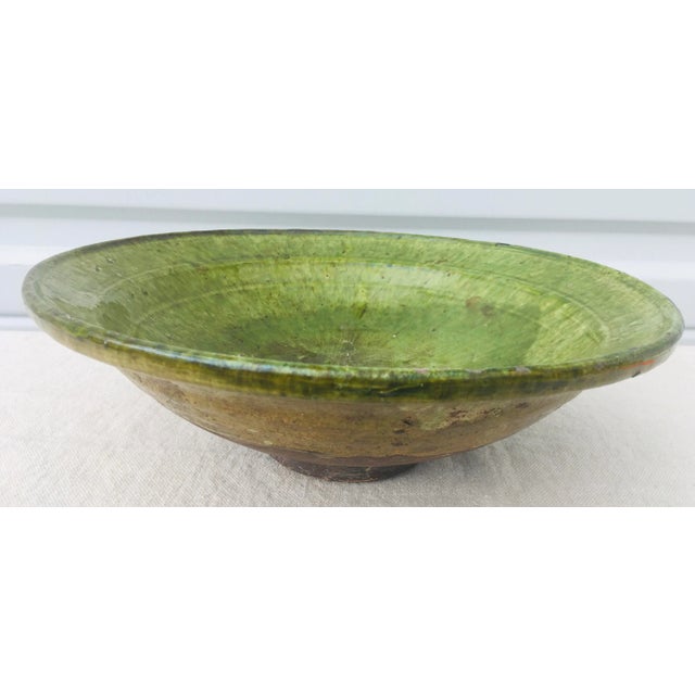 This is a vintage Mediterranean handmade pottery bowl. This pottery bowl features an Apple green glaze to the inside of...
