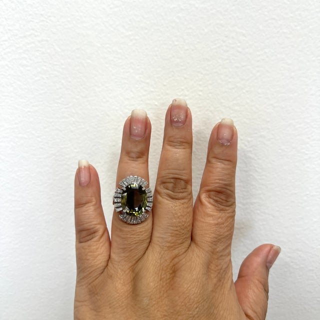 Gorgeous 10.31 ct. color change alexandrite oval with 2.5 ct. good quality white diamond baguettes. Handmade in platinum....