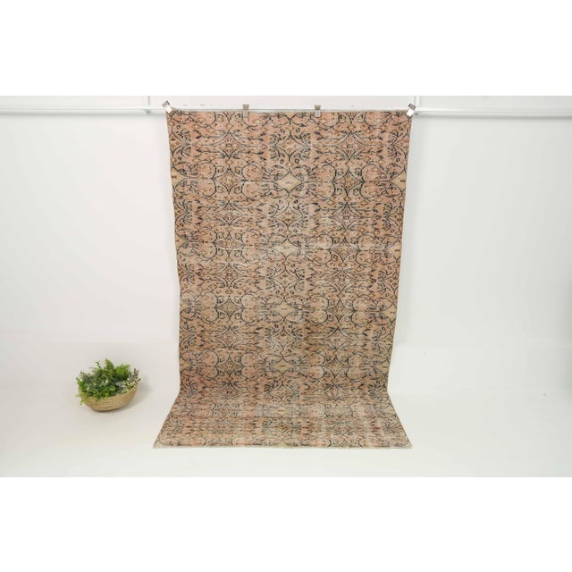 This vintage hand-knotted area rug is a semi-antique vintage area rug. The '70s Eastern Anatolian region's unique rug is...
