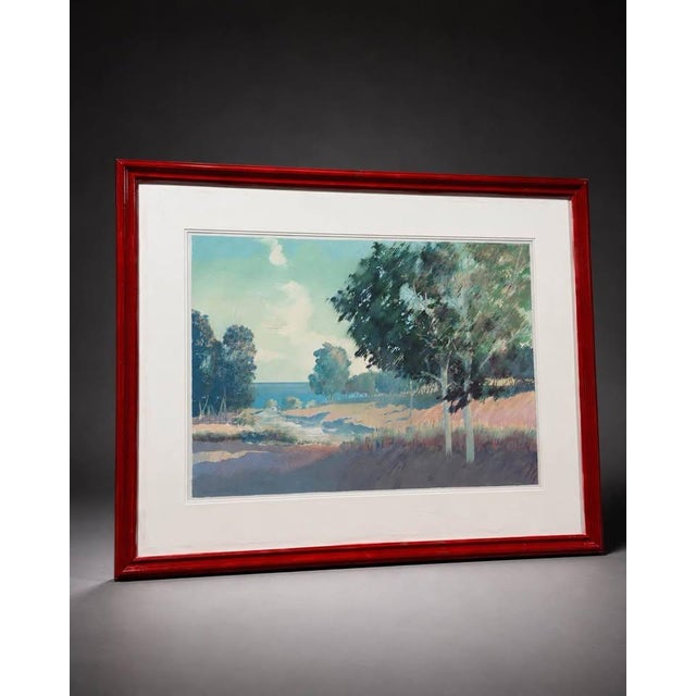 Oversized framed landscape artwork featuring a soft coastal / countryside scene with blue, green, pastel, and neutral...