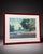Oversized framed landscape artwork featuring a soft coastal / countryside scene with blue, green, pastel, and neutral...