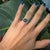 A 4.1ct round 9mm star sapphire ring set in solid 14K gold, accented with natural diamonds for added brilliance. Elegant...