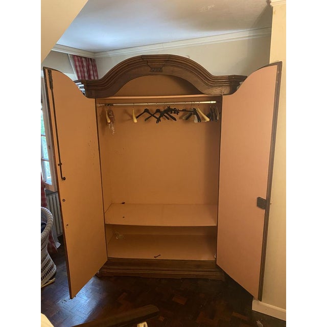 17th century wardrobe in walnut wood with double door with a retractable secret at the base of the closet.