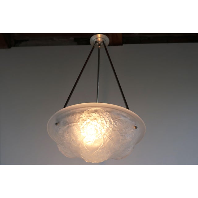 Gorgeous & Timeless! This French Art nouveau / early Art Deco pedant light from the 1920s Amazing pressed glass shade...