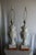 Grand pair of white porcelain lamps, carved with beautiful designs throughout, resting on wooden bases. They are wired and...