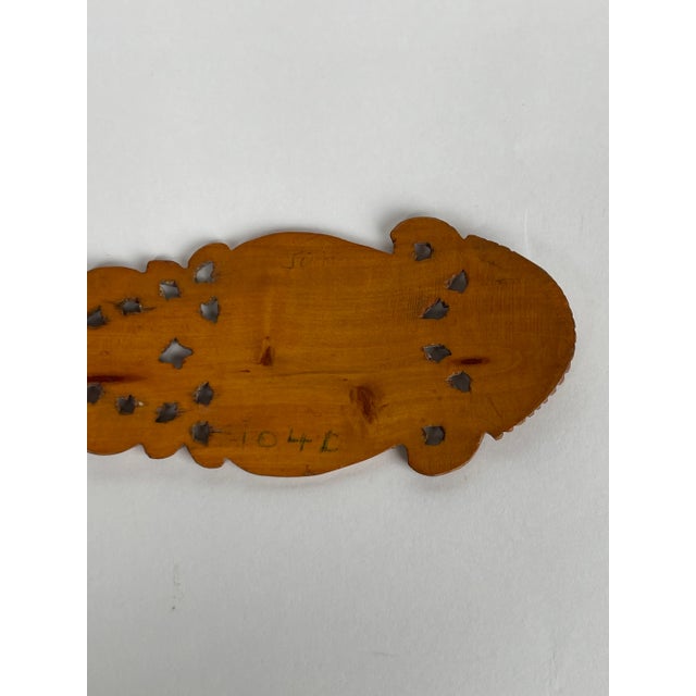 A Persian Qajar Hand Carved Wooden Sherbet Spoon. Iran, Circa 1880. The intricate carving, often with pierced and relief...