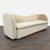 This West Elm 3-seat sofa features a modern curved design and soft beige upholstery. It offers a generous seating area and...