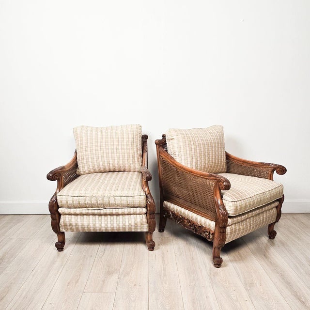 A pair of Edwardian caned club chairs, circa 1920. Seat height 18.5".