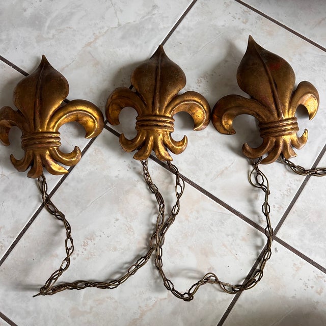 Rare vintage 1950s Salvador Italy handmade gilt metal light fixture featuring three dramatic Fleur De Lys sconces...