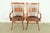 A gorgeous pair of Mid-Century Modern sculpted walnut armchairs or dining captain chairs In the manner of George Nakashima...