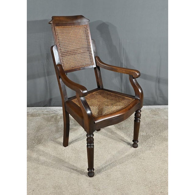 Hairdresser's or barber's armchair in beech stained in the Louis-Philippe style, characterized by its height-adjustable...