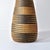 The Tutsi Wedding Basket Vase, originating from Rwanda, stands as a unique masterpiece of Rwandan artistry and cultural...