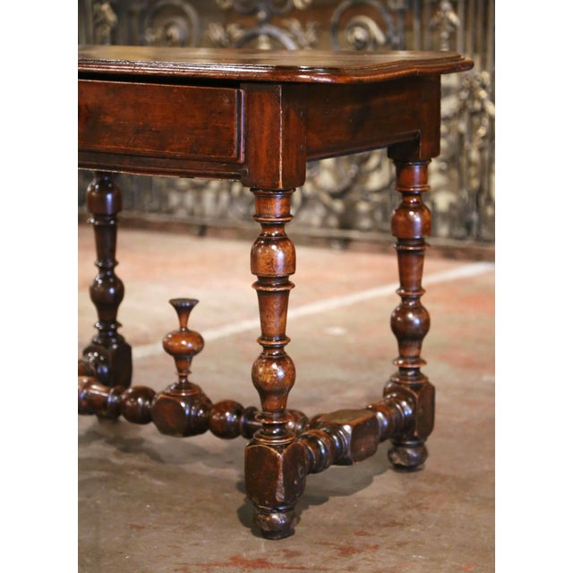 Incorporate extra, functional surface space into your living room or den with this elegant antique side table. Crafted in...