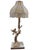 Striking vintage sculptural table lamp featuring a detailed bird perched on a naturalistic tree trunk, paired with an...