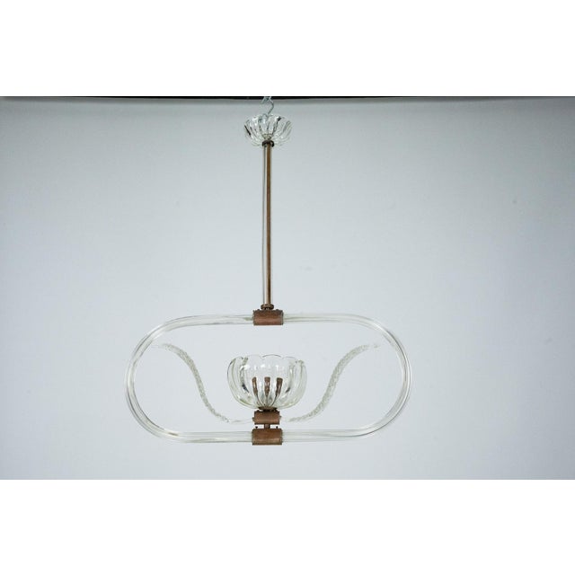 Art Deco Clear Murano glass chandelier produced in Italy during the 40s. It mounts a socket for E27 bulb. In very good...
