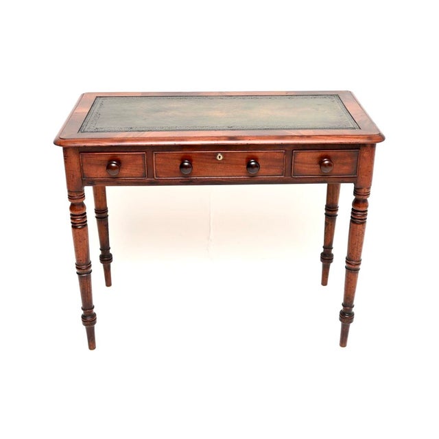 A charming antique early Victorian leather top writing table / desk. This was made in England, it dates from around the...