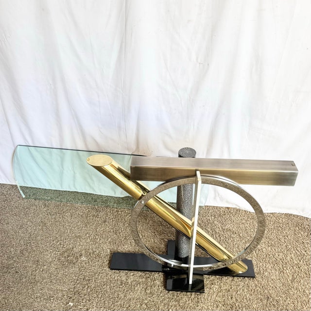 A striking Postmodern console table designed by Kaizo Oto for the Design Institute of America. This sculptural piece...