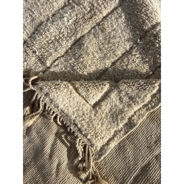This new handmade Mrirt Moroccan rug is a refined and timeless piece of Berber craftsmanship, created entirely by hand...