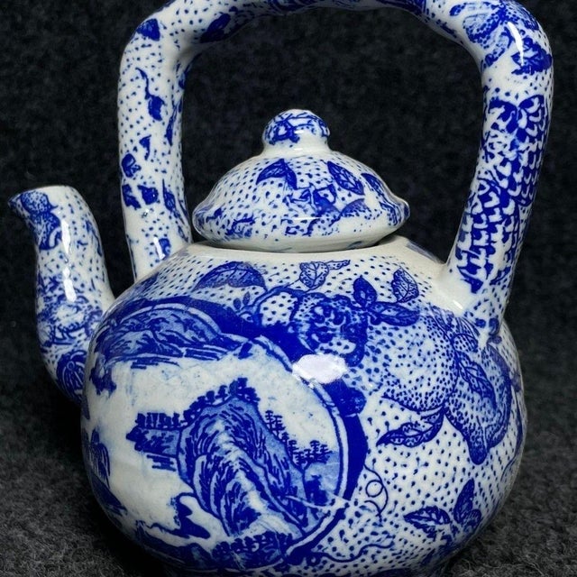 This is a beautiful vintage Chinese blue and white porcelain teapot, designed in the traditional "Tiliang" (overhead...