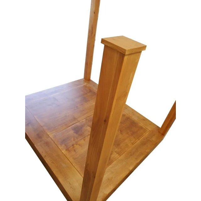 Modern king platform poster bed. The bed is made of alder. The color shown is a natural matte finish. The platform allows...