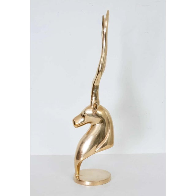 Brass Gazelle Sculpture on brass base. Good overall condition, light or dark areas are reflection only. Ready to display