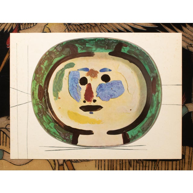 An excellent vintage period print of Pablo Picasso's ceramic Platter depicting a Young Smiling Face. Comes from an art...