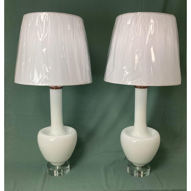 A stunning pair of vintage Murano glass table lamps, handcrafted in Italy and featuring sleek, sculptural silhouetted in...