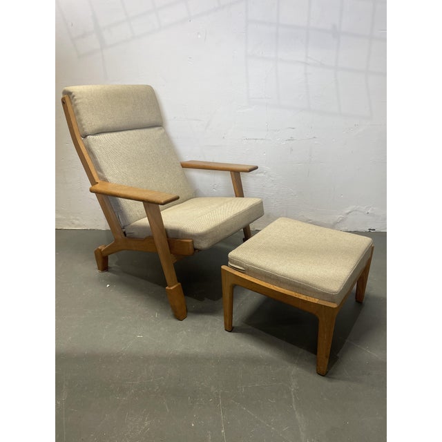 Beautiful armchair with ottoman by Hans Wegner for Getama Gedsted of Denmark. This is model GE290. The armchair and...